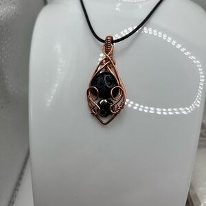 Handcrafted Copper Wire Wrapped Black Onyx Pendant.